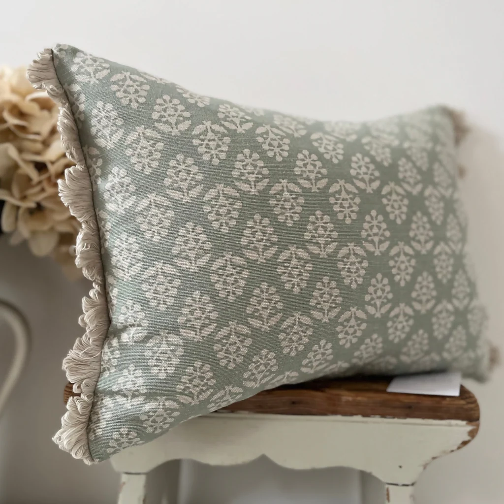 Oblong fan edge cushion in Susie Watson Duck Egg Sprig cotton
