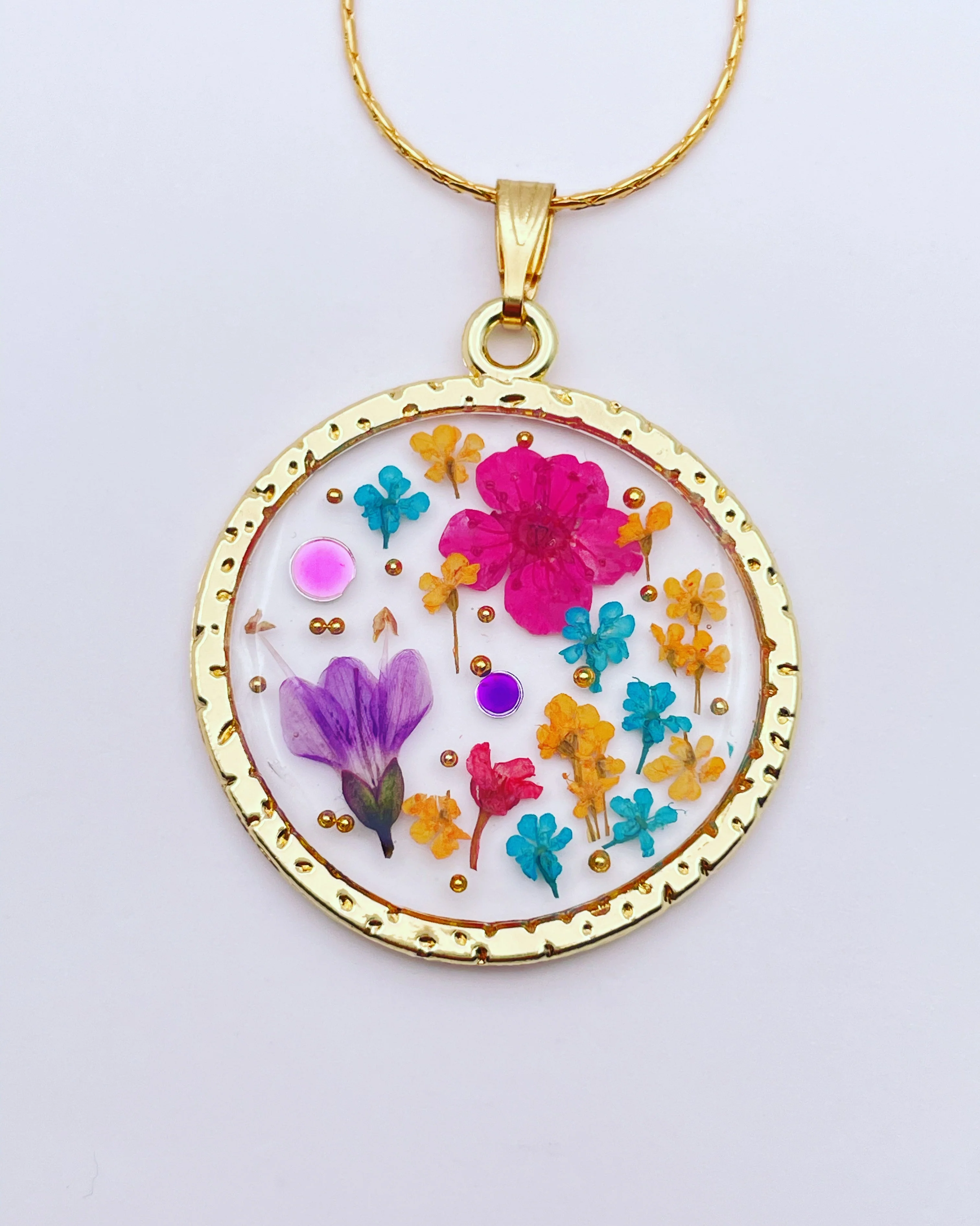 Statement necklace with pink lily flowers in gold